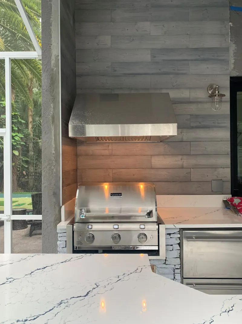 Outdoor kitchen by a custom pool — Central Florida 1