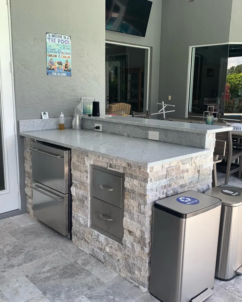Outdoor kitchen by a custom pool — Central Florida 3