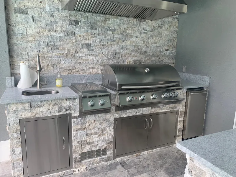 Outdoor kitchen by a custom pool — Central Florida 4