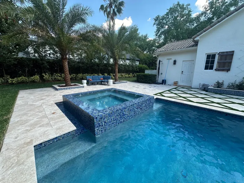Spa addition with spillover water feature — Next Level Pools and Spas 1
