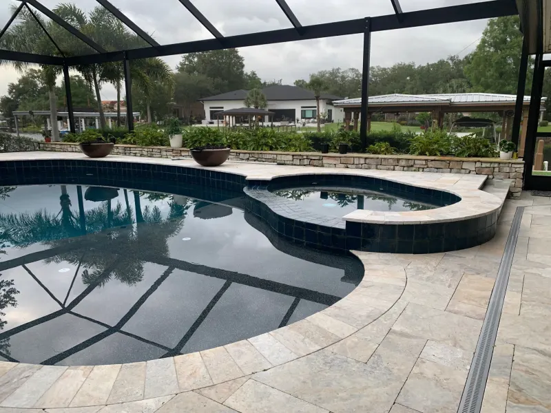 Spa addition with spillover water feature — Next Level Pools and Spas 4