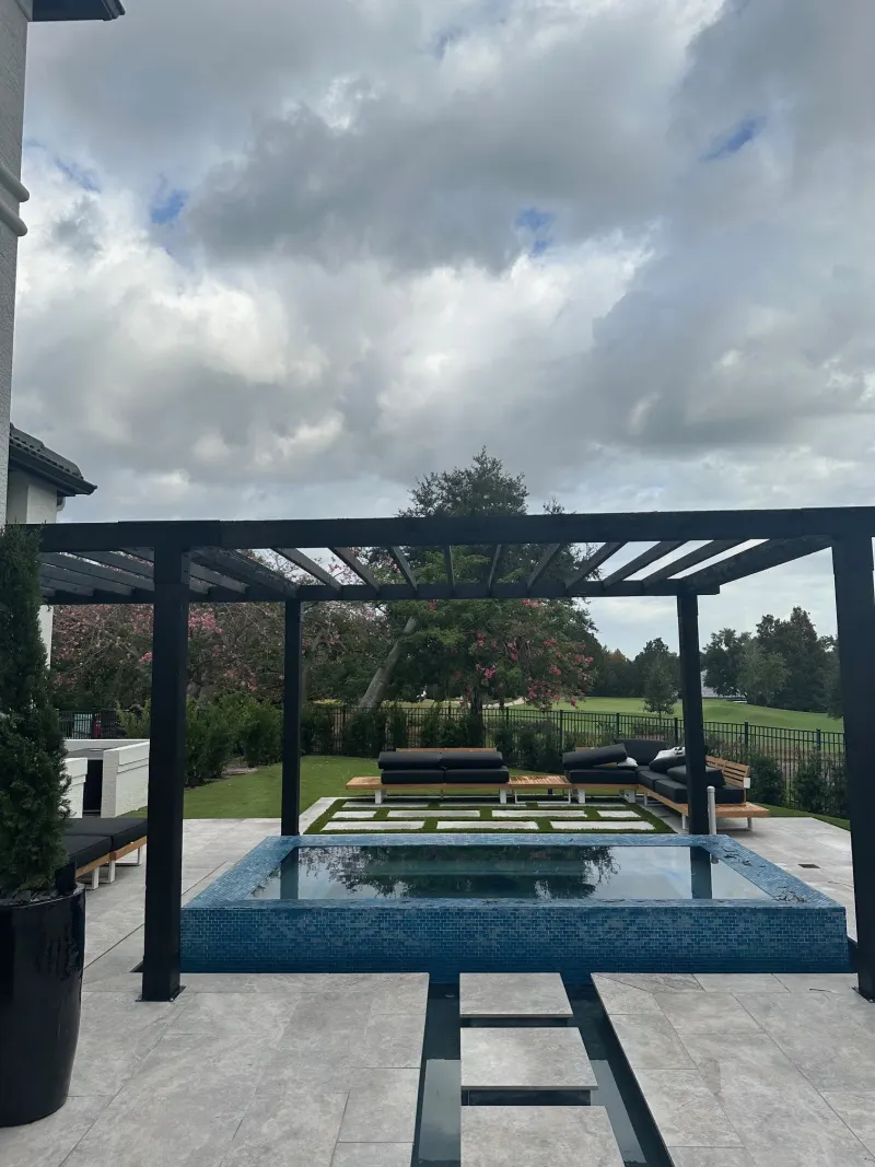 Spa addition with spillover water feature — Next Level Pools and Spas 6