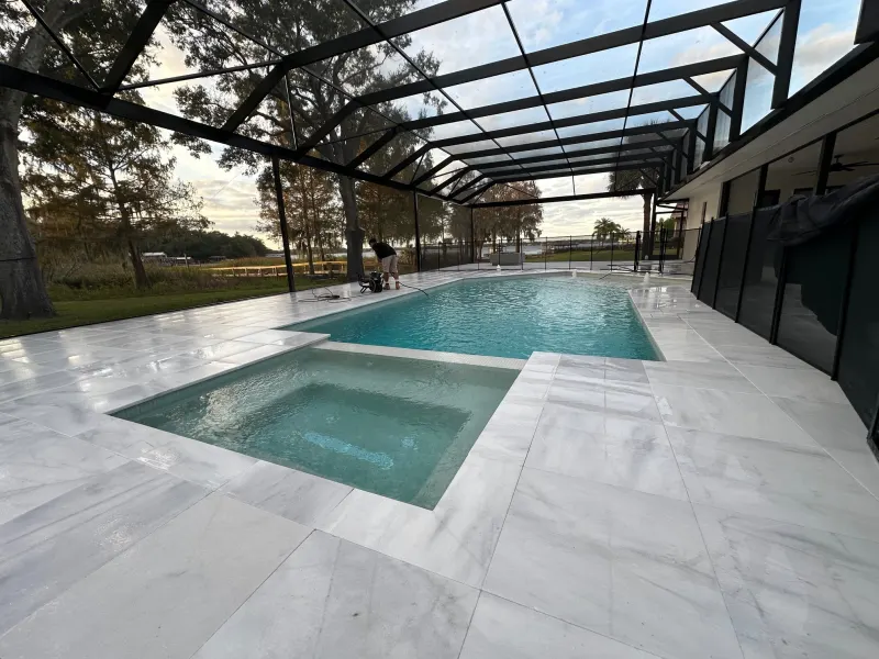 Spa addition with spillover water feature — Next Level Pools and Spas 9