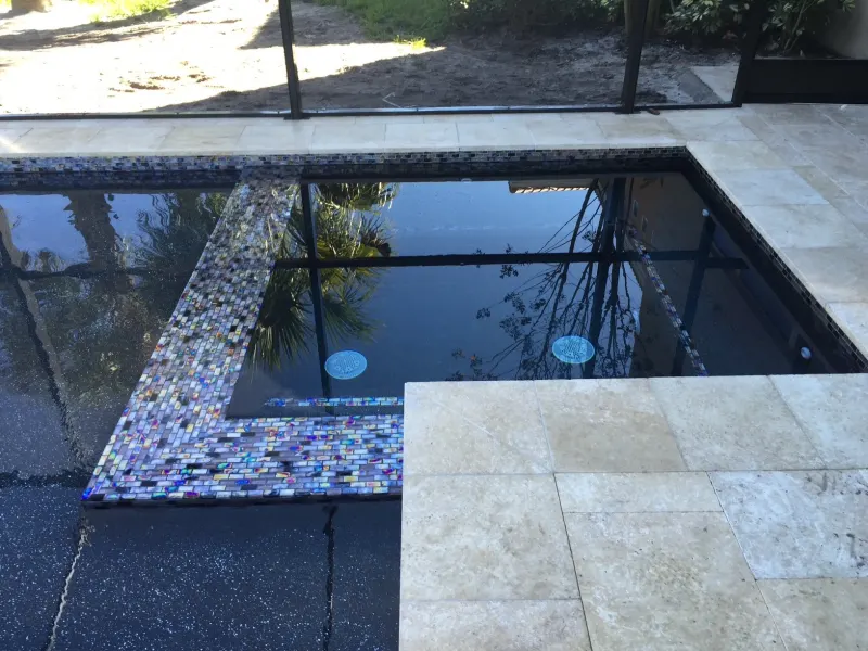 Spa addition with spillover water feature — Next Level Pools and Spas 10