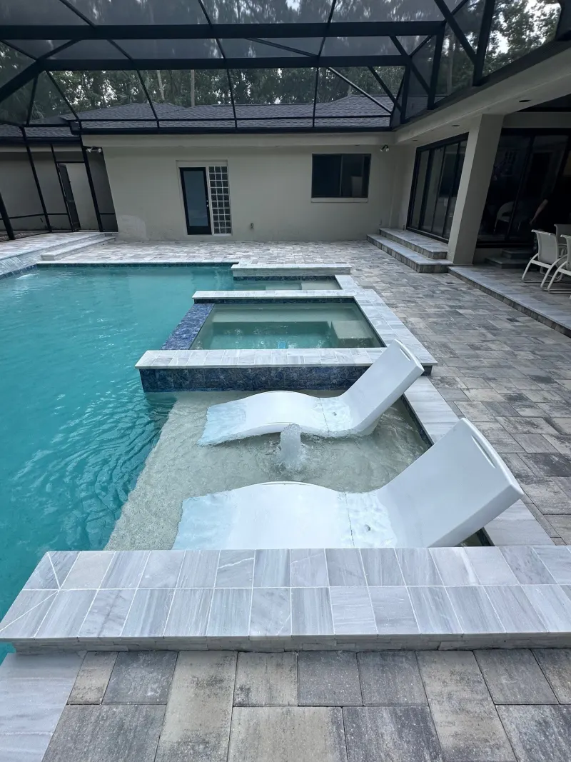 Signature sun shelf detail in a custom pool — Next Level Pools and Spas 1