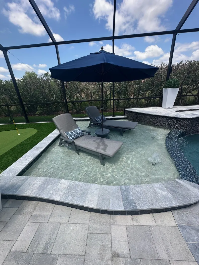 Signature sun shelf detail in a custom pool — Next Level Pools and Spas 4