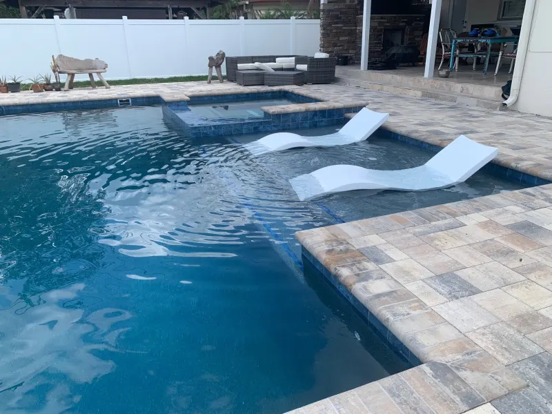 Signature sun shelf detail in a custom pool — Next Level Pools and Spas 6