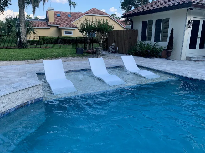 Signature sun shelf detail in a custom pool — Next Level Pools and Spas 9